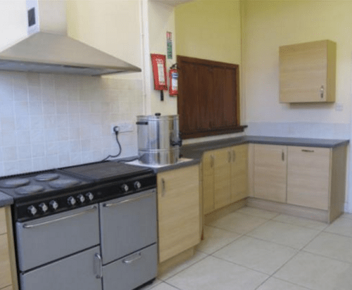 Enderby Civic Centre: Kitchen (view - showing serving hatch - from interior towards entrance door)