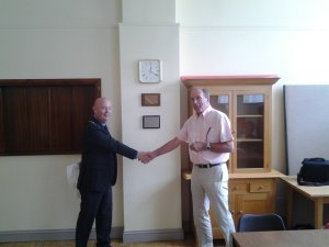 Present Chairman, Nigel Grundy, shaking hands with Brian Cooper who signed the original Twinning Charter 30 years ago.